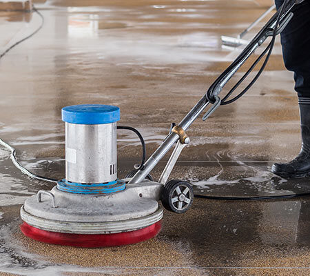 man-cleaning-bus-station-with-cleaning-machine